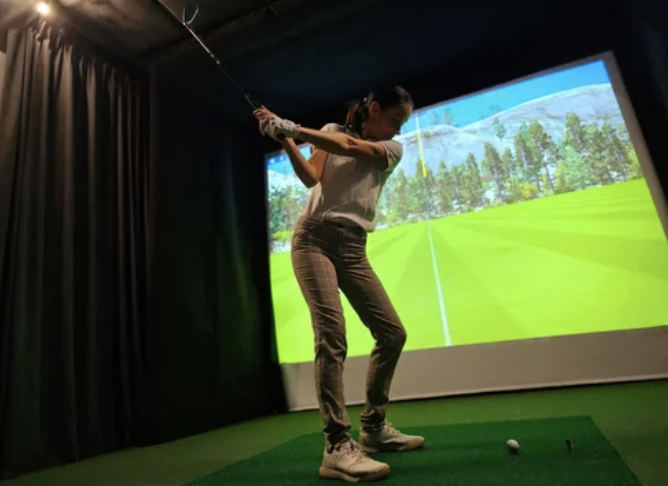 Golfer enjoying a private simulator session